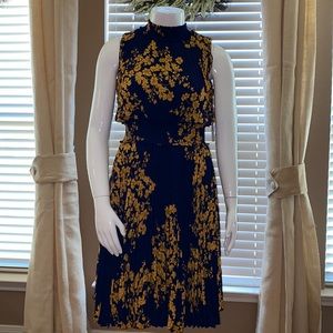Women’s navy blue and gold pleated dress